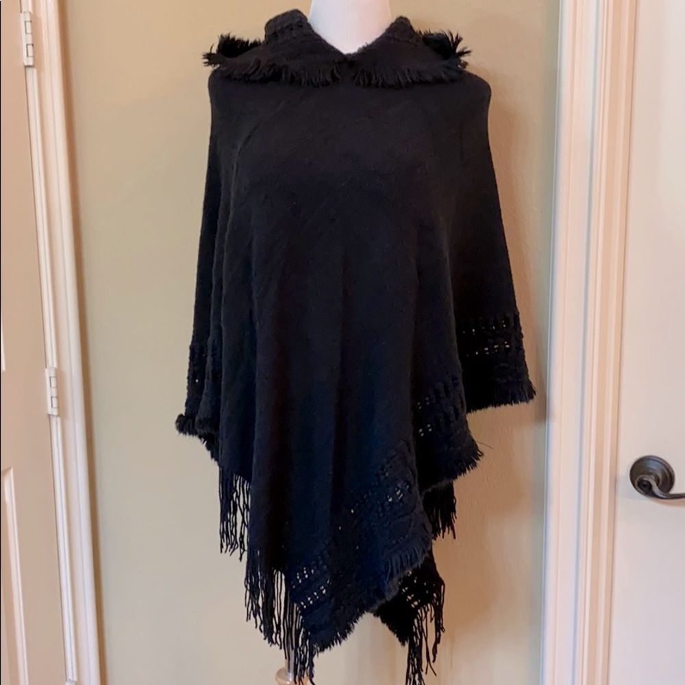 Asymmetrical poncho with a hoodie.